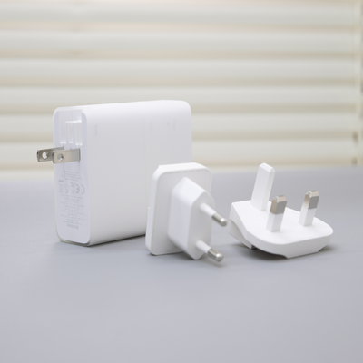 BricBloc charger with US, EU, and UK plug adapters.